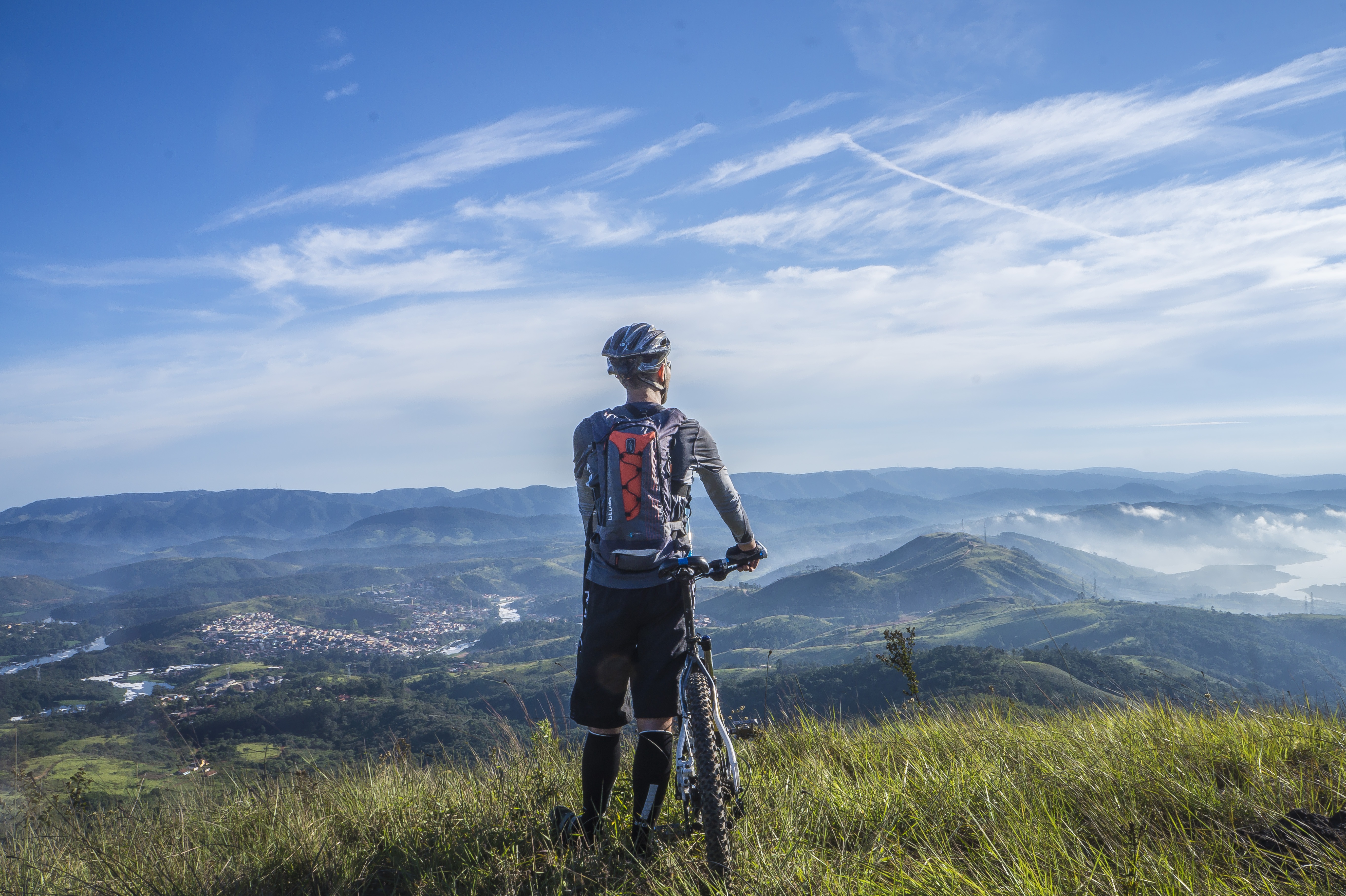 There are many alternatives to running. One of them is cycling. Here a man is standing with his cycle.