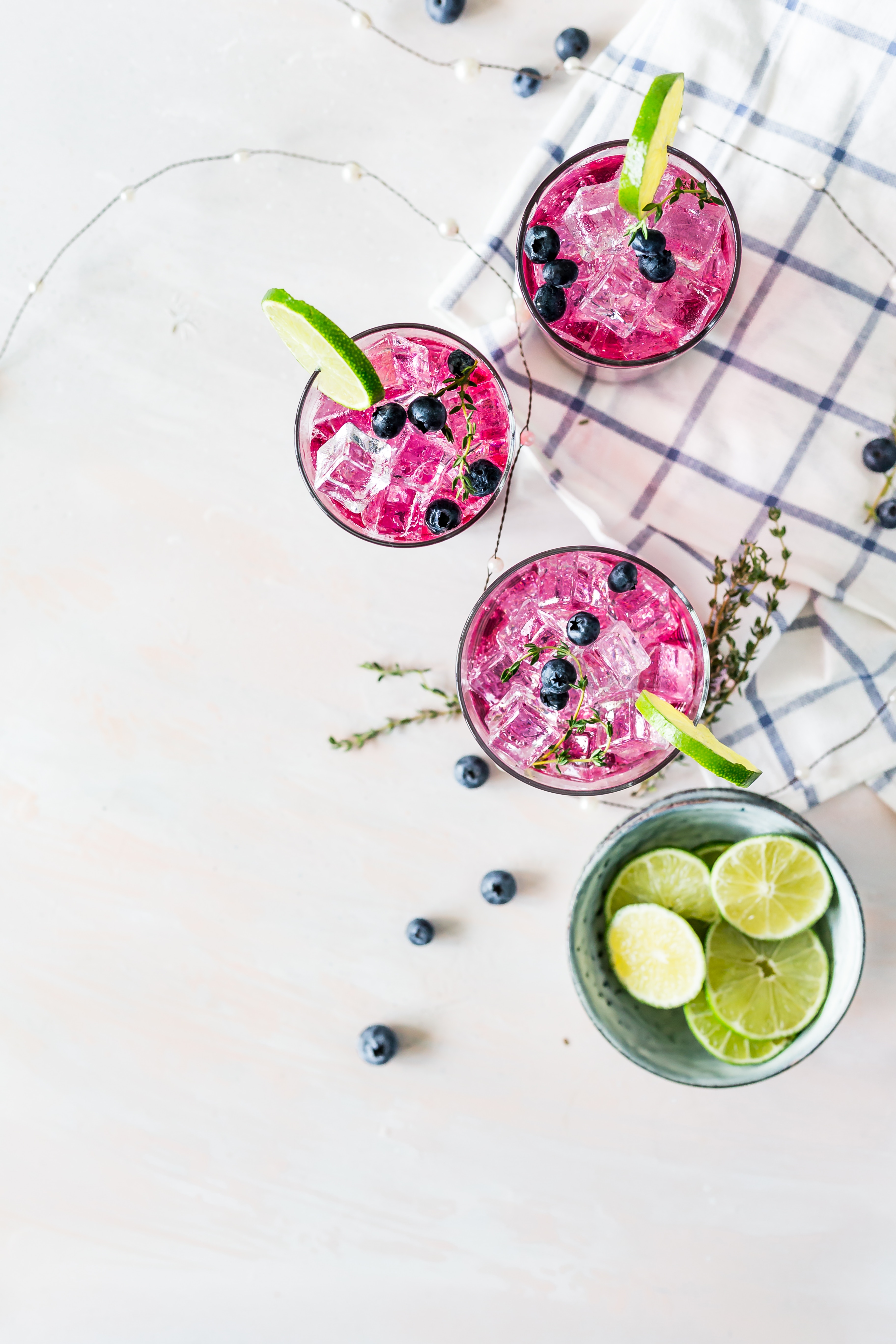 There are many tasty ways to drink more water. Here are a few tasty ways. Here is a glass of water with berry, lemon and ice.