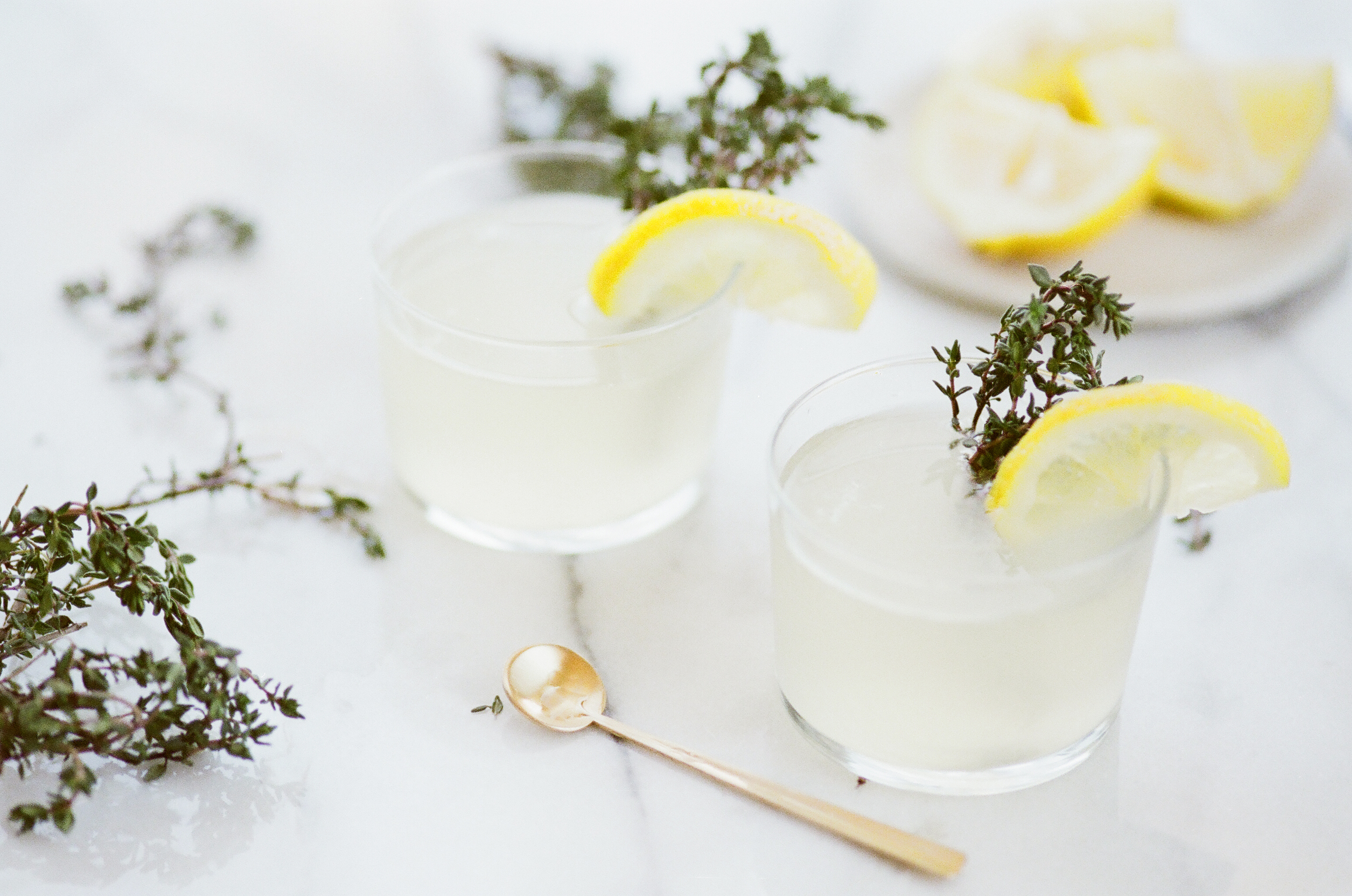 Tasty way to drink water is adding mint and lemon in it. Here is glass filled with water along with lemon and mint.